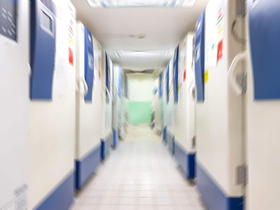 Blur abstract background of ultra low temperature freezer for specimens storage in laboratory testing in medical hospital.Blurry view rows of refrigerators for research in university